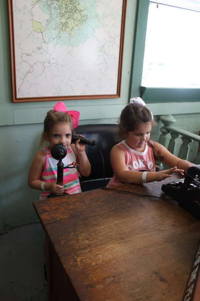 Kids playing at Sheriff Andy's desk