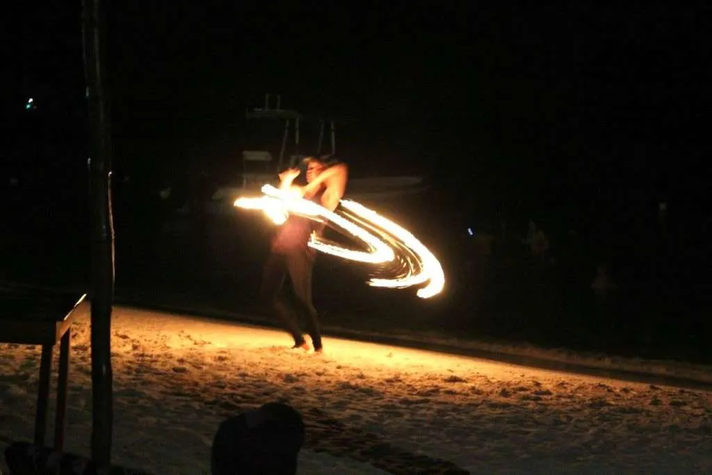 things to do in Roatan watch fire dancers