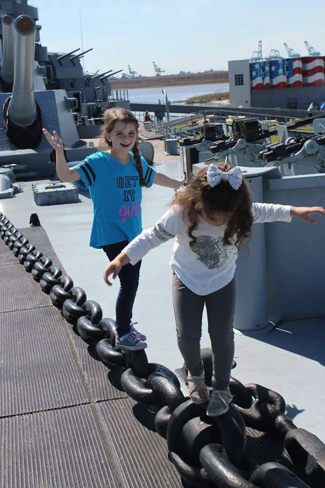 kids playing on the deck of the USS Alabama