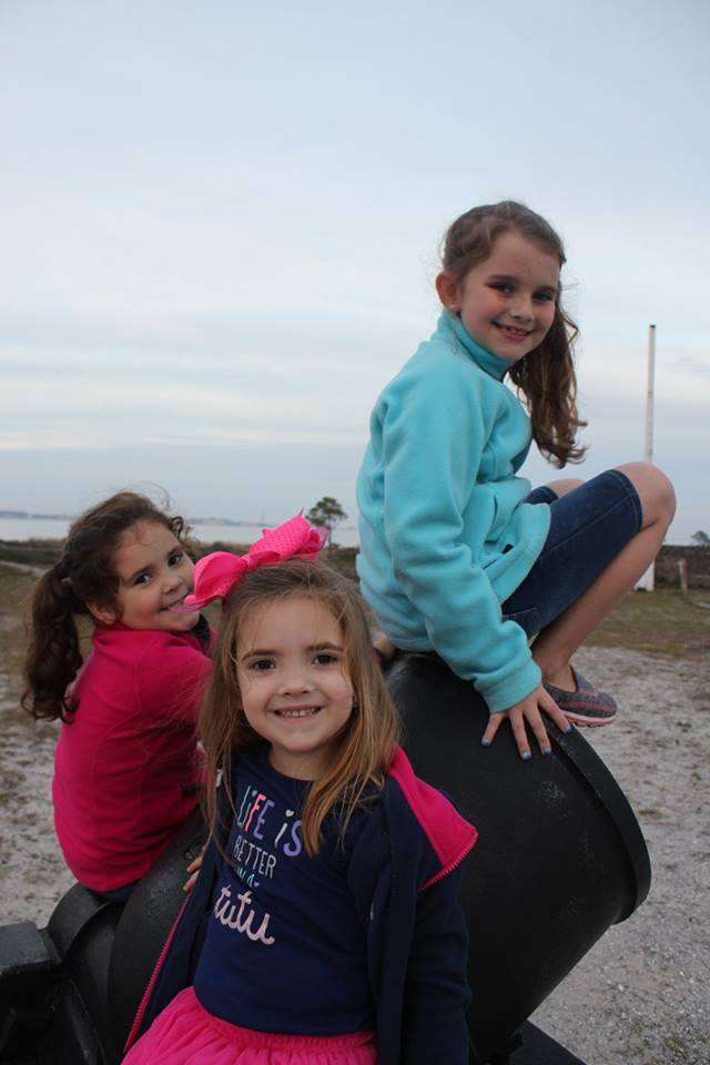 girls on cannon at Fort Pickens in Pensacola