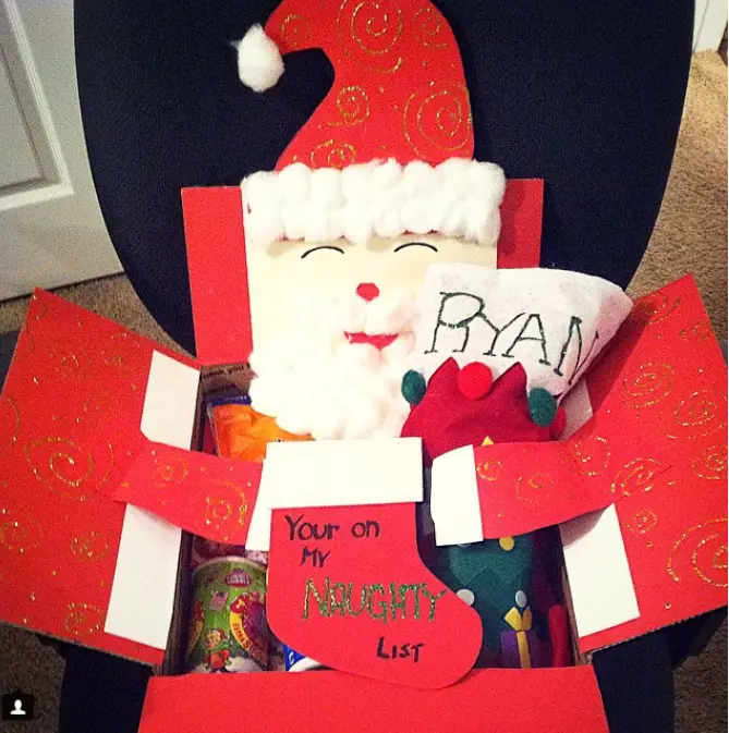 Christmas care package decorated like Santa Claus