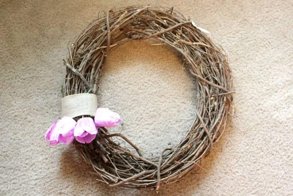 how to make a spring wreath - start placing tulips at the bottom of the ribbon