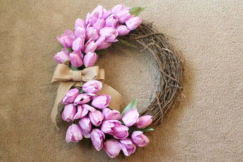 how to make a spring wreath - add burlap bow as the finishing touch to your wreath