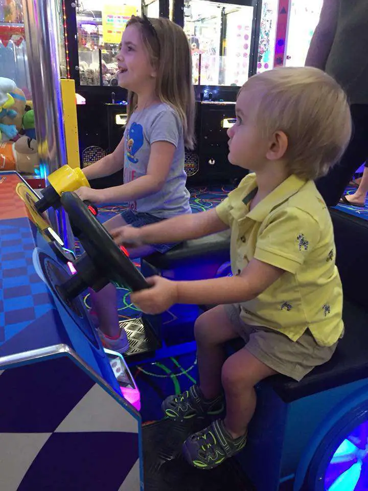 kids playing a racing game at Fun Stop arcade in Pigeon Forge