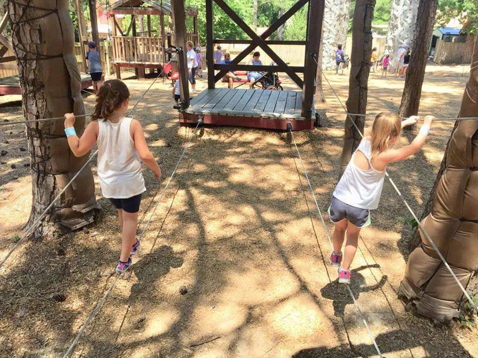 Girls playing on the rope course at Stone Mountain, Georgia.