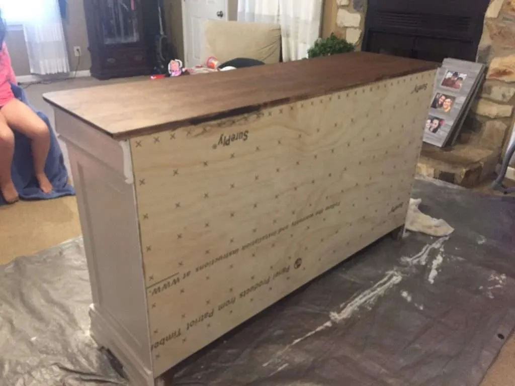 After putting plywood on the back of the farmhouse buffet.