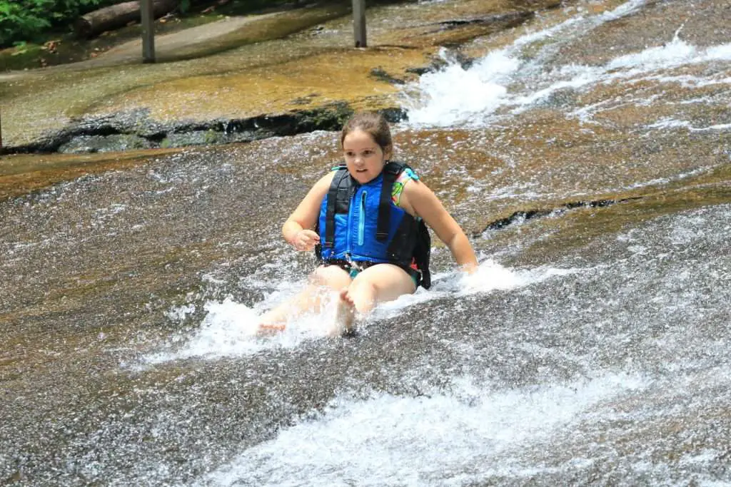 Going down a natural water slide.