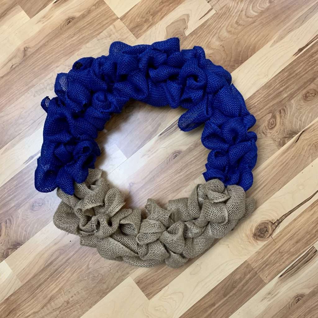 Add the blue burlap to the wreath form.