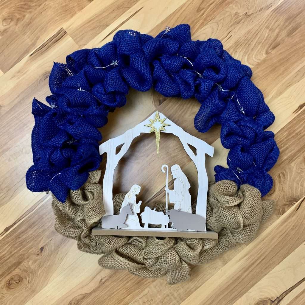 Step 5: Add the Nativity scene to the wreath.