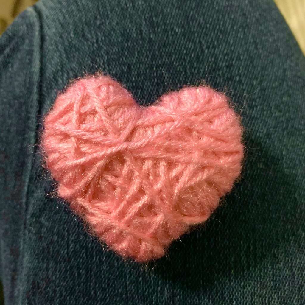 Yarn wrapped heart for Valentine's Day wreath.
