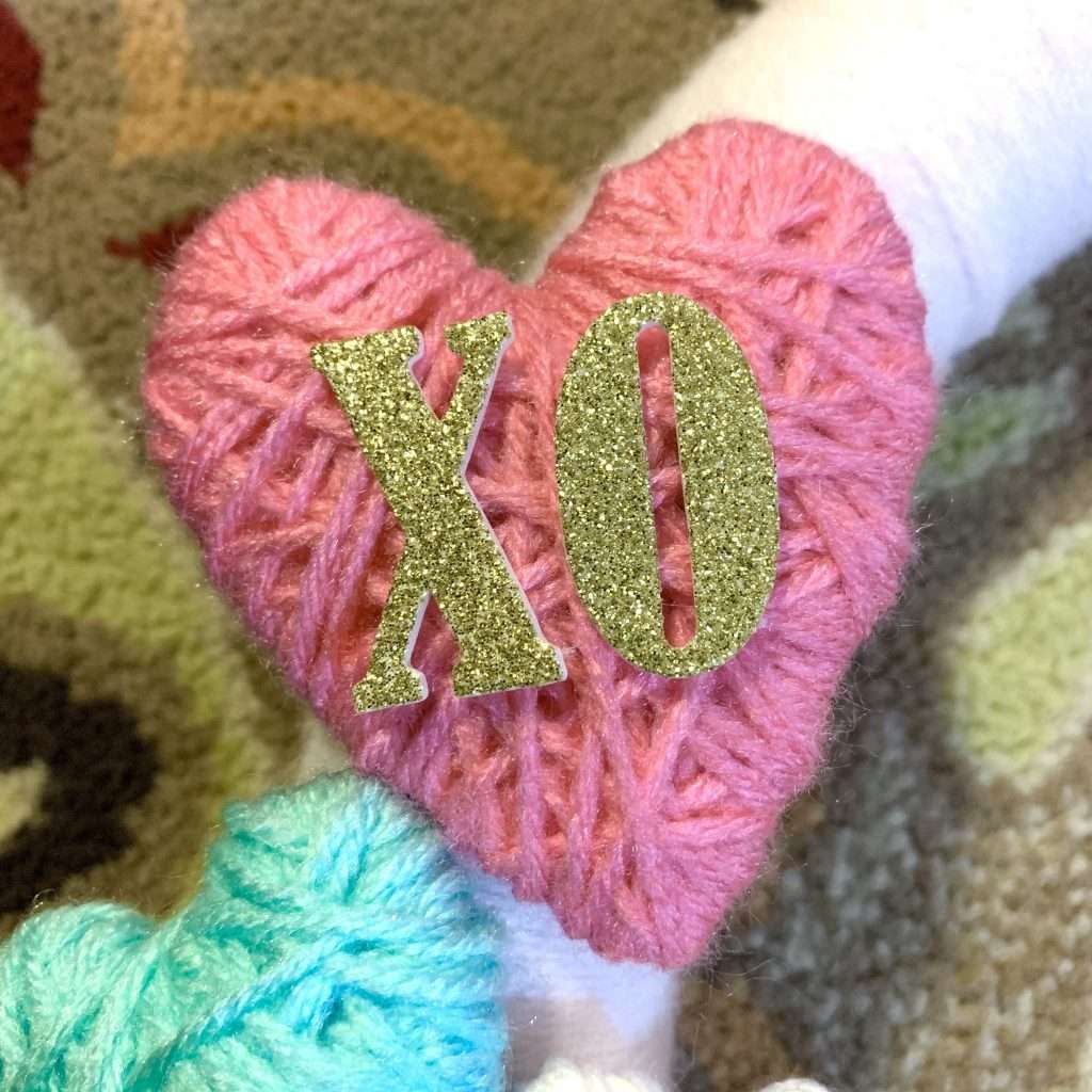 Glitter letters added to the Valentine's Day wreath.