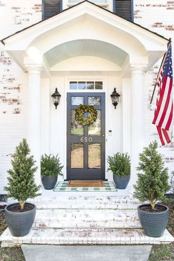 Decorate your front stoop with simple symmetry.