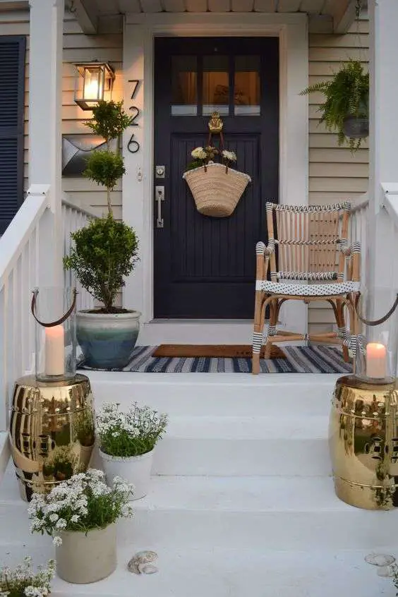 This small porch is big on style with it's navy, white, and gold accents.