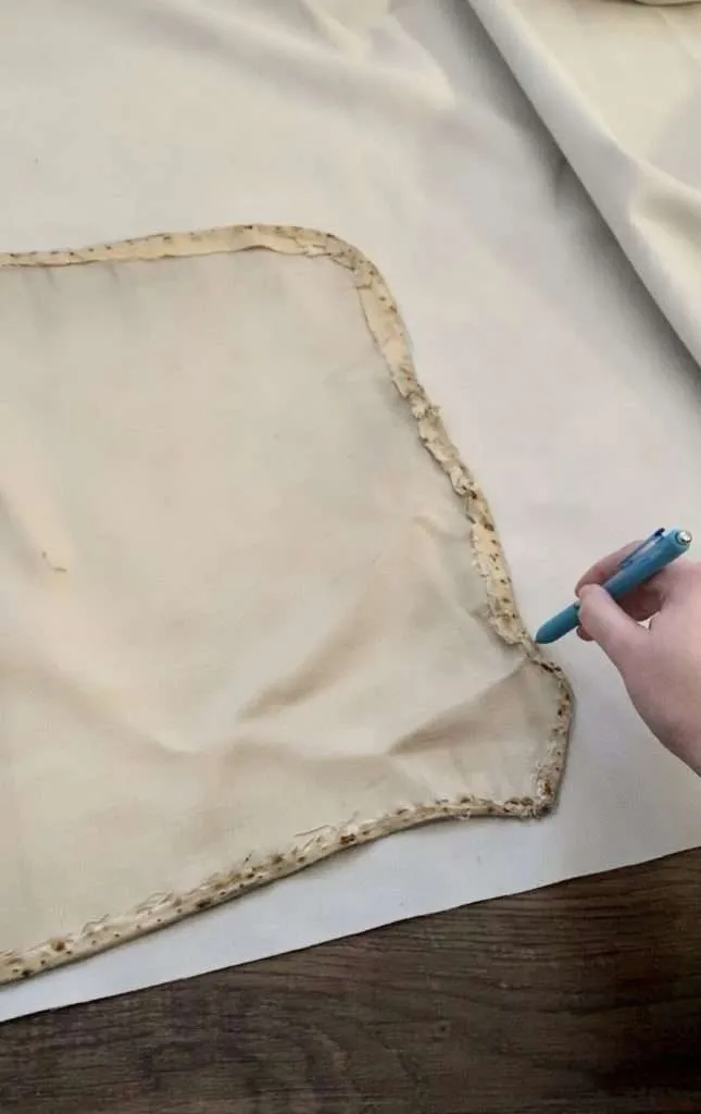 Trace the old fabric from the antique bed onto the new fabric.