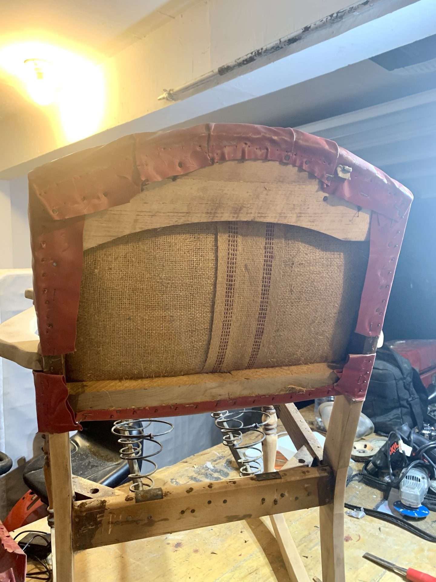 Burlap backing in an antique rocking chair.
