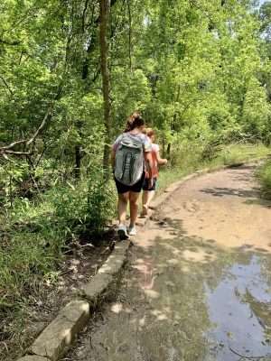 Avoiding the mud puddles on our hike in Belton, TX.