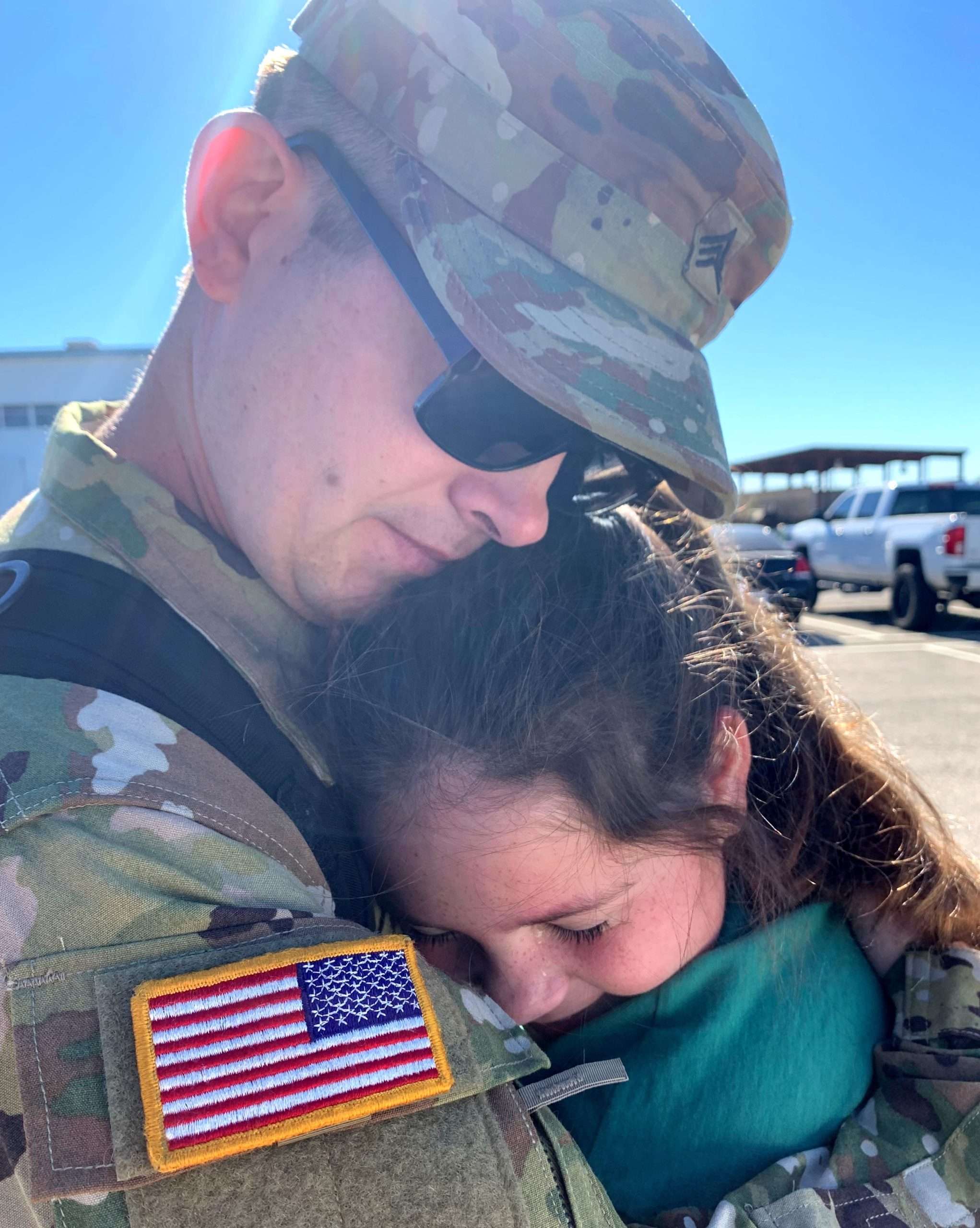 Soldier hugging his daughter before deployment | Finding Mandee