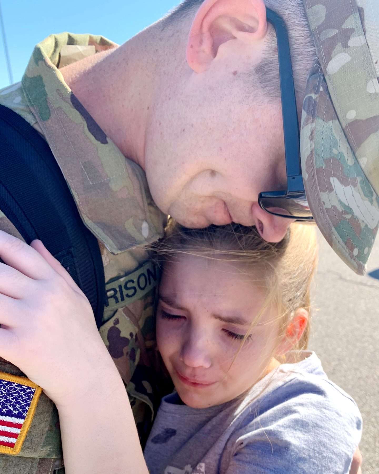 Soldier hugging daughter before deployment | Finding Mandee