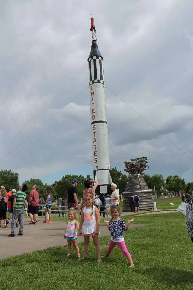 Girls in front of rocket at the NASA Space Center in Houston, TX.