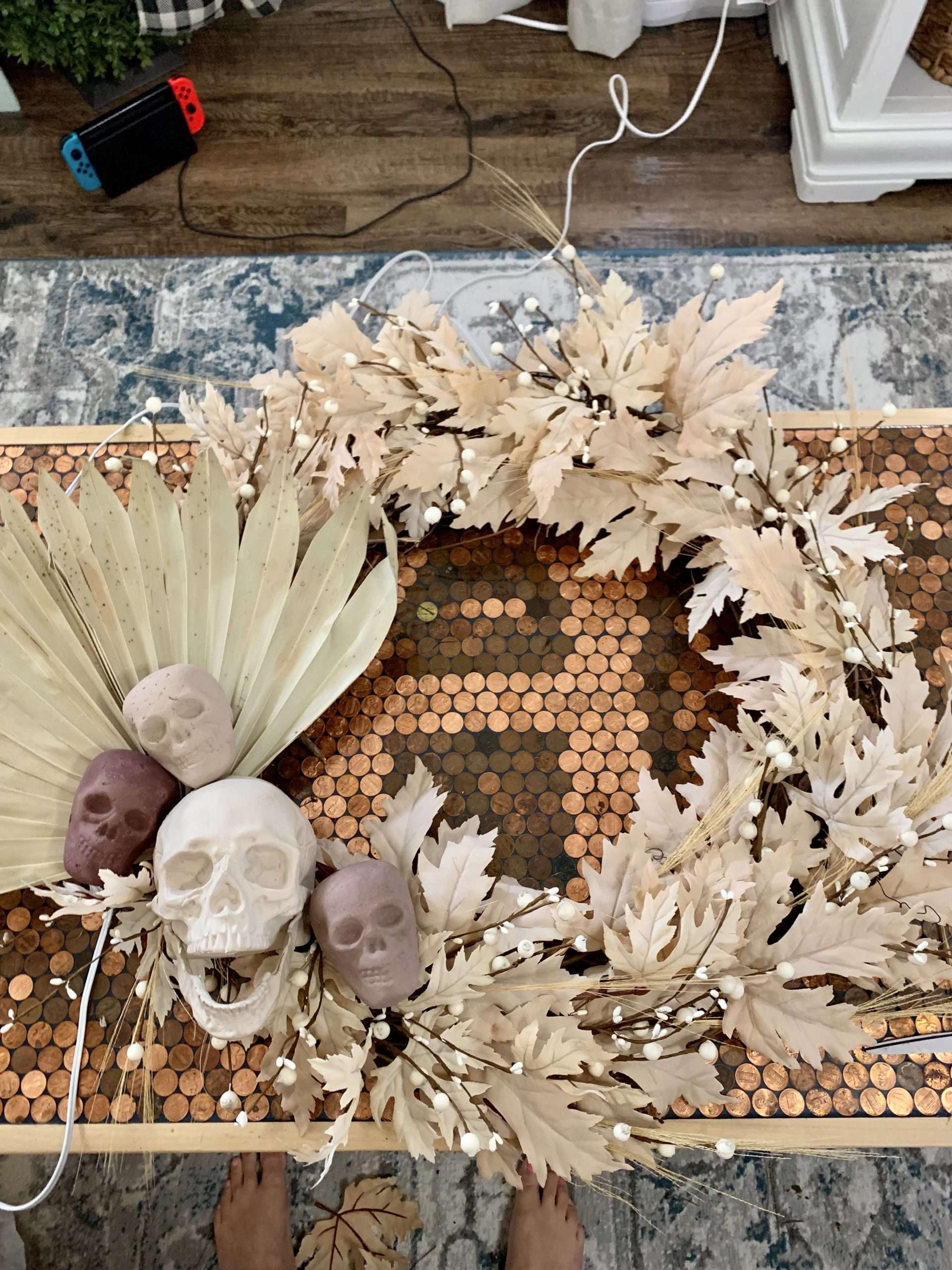 After adding leaves, berries, and grass to the boho Halloween wreath.