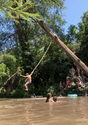 Rope swing on Little Cypress Creek in Texas.