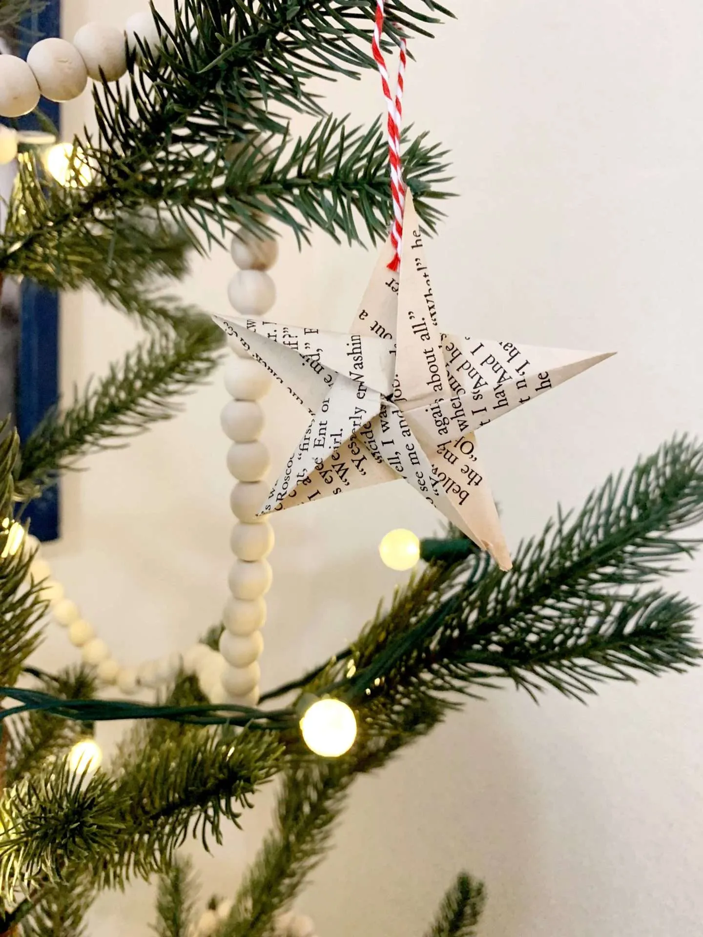 Origami stars made from vintage book pages on a bookish Christmas tree.