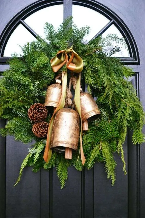 Christmas bells in the center of a green wreath