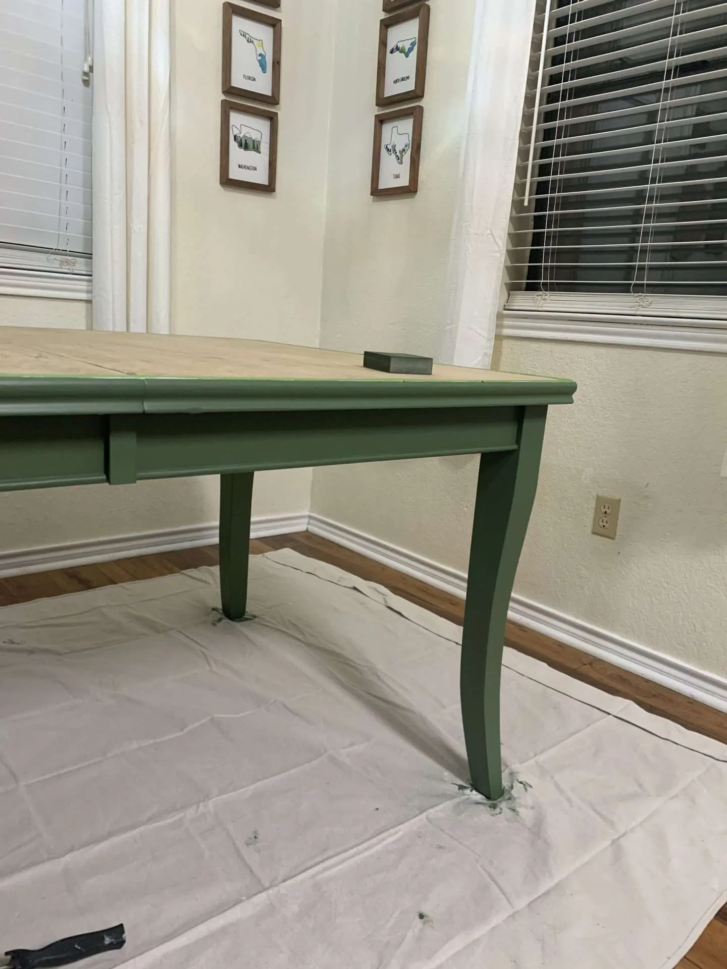 After putting 2 coats of paint on the dining room table.