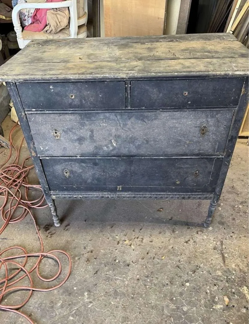 The before picture of the antique dresser that we refurbished.