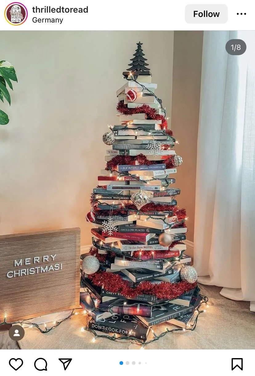 Bookmas Tree Ideas: books stacked up and decorated like  Christmas tree