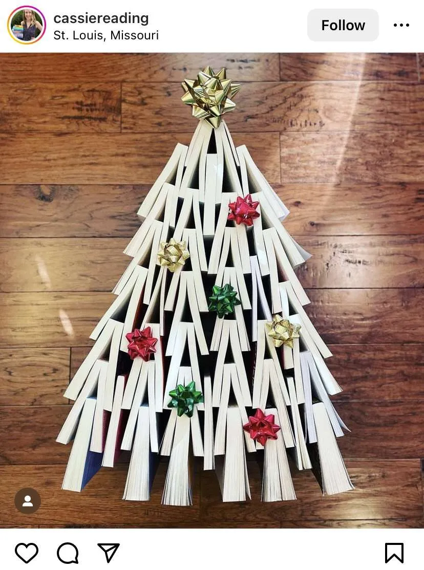 Bookmas trees: books laid on the floor in the shape of a Christmas tree 