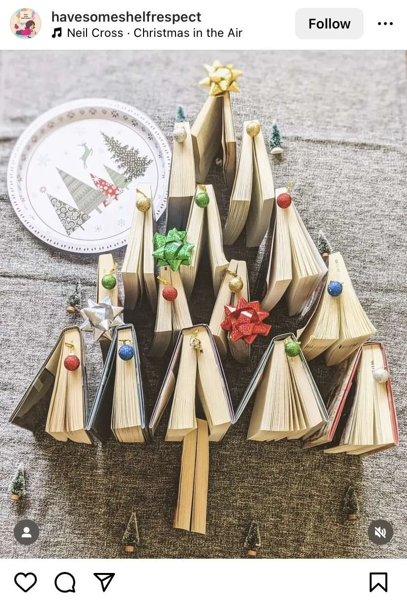 Bookmas tree ideas: stand books on the floor in the shape of a Christmas tree