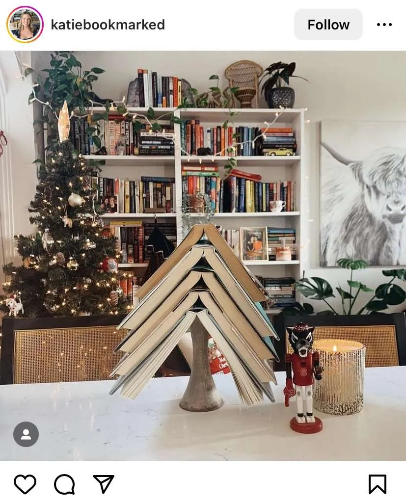 Bookmas tree ideas: open books stacked on top of a thick candlestick.