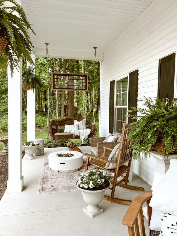 Decorate a narrow porch using a woods and whites color scheme.