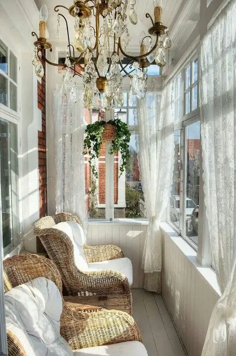 Narrow porch decorating ideas: hang a chandelier to look extra fancy.