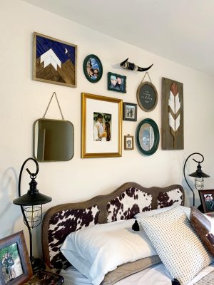 Western eclectic wall collage and master bedroom decor.