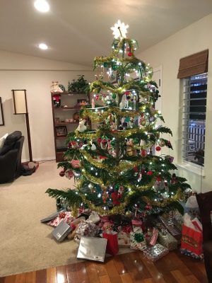 Norfolk Pine Christmas Tree Decorating Ideas: Gold tinsel garland.
