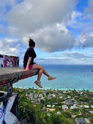 Girl sitting on the Lanikai Pillbox.